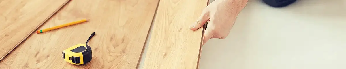 A professional installing wood flooring in Santa Ana, CA