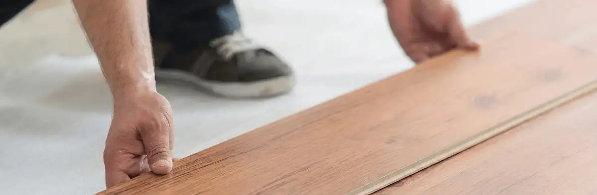 A professional installing laminate flooring in Santa Ana, CA