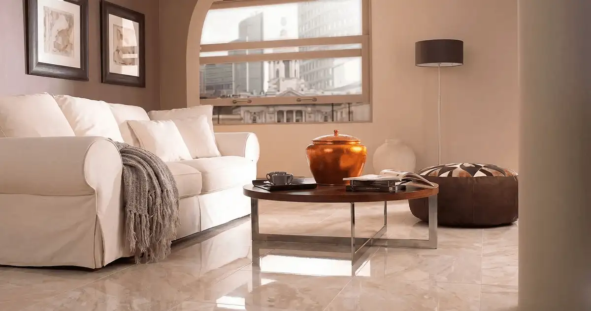 Modern living room with professionally installed marble flooring, a beige sofa, coffee table in Santa Ana, CA