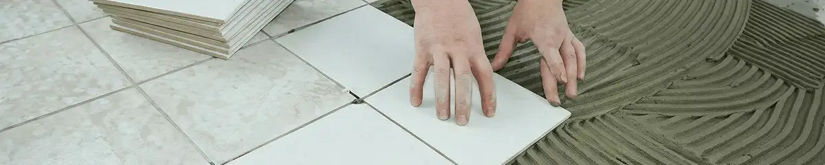 Professional installing white tile floors in Santa Ana, CA