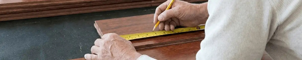 A professional installing wood flooring in Santa Ana, CA